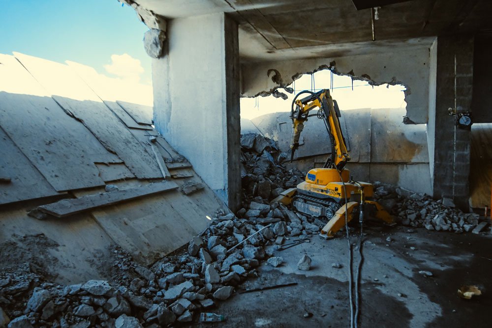 Concrete staircase flight cut into sections ready for removal from a villa