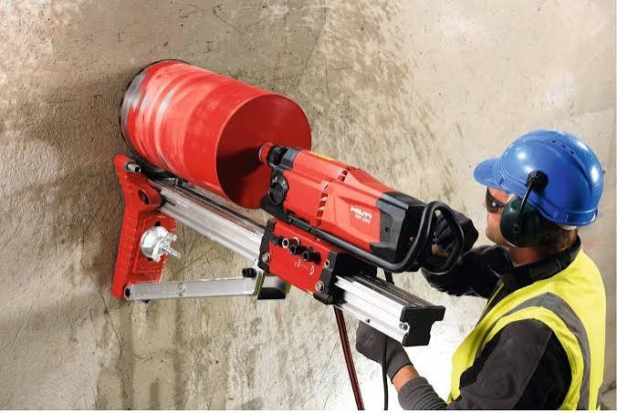Diamond core drilling rig anchored to a concrete slab on a UAE site