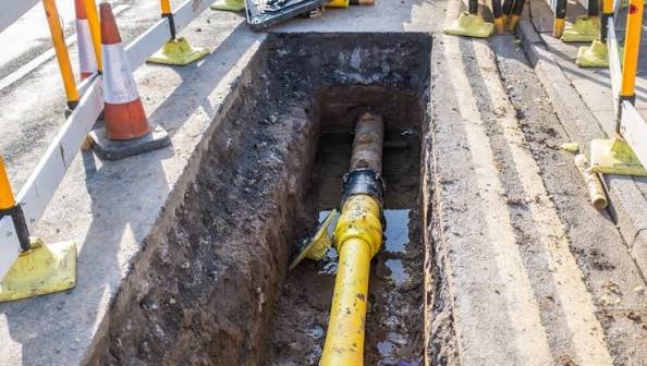 Floor saw cutting a trench in a ground slab